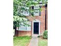 Traditional brick home with trimmed greenery and sidewalk at 401 Autumn Leaf Way, Norcross, GA 30093