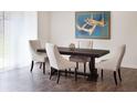 Elegant dining room featuring a dark wood table, upholstered chairs, and a striking piece of artwork at 55 Bandimere Pkwy, Dallas, GA 30157