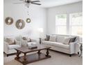 Bright and inviting living room with modern furnishings, neutral tones, and ample natural light at 55 Bandimere Pkwy, Dallas, GA 30157