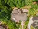 Expansive outdoor space with multiple decks and patios perfect for entertaining, surrounded by mature trees and landscaping at 8470 Lazy Oaks Ct, Atlanta, GA 30350