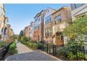 Beautiful townhome showcasing brick facade and lush landscaping along a paved walkway at 621 Broadview Ne Ter, Atlanta, GA 30324