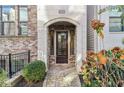 Charming front entrance with a stone archway and brick detailing at 621 Broadview Ne Ter, Atlanta, GA 30324
