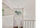 Bright foyer with tall windows, a view of the front yard, and white trim at 2240 Creekside Vw, Decatur, GA 30035