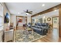 Bright living room featuring beautiful wood beam accents, lots of natural light, and a comfortable seating area at 604 Continental Dr, Lawrenceville, GA 30044