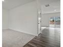 Spacious living room featuring carpeted and hardwood flooring at 119 Champions Blvd., Dallas, GA 30157