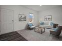 Bright living room featuring a modern design with neutral colors and comfortable seating at 119 Champions Blvd., Dallas, GA 30157
