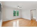 Spacious bedroom offers natural light from large windows overlooking lush greenery at 3621 Vinings Slope Se # 3510, Atlanta, GA 30339
