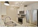 Well-lit kitchen featuring stainless steel appliances, granite countertops, ample cabinet space, and a stainless-steel sink at 1101 Juniper Ne St # 632, Atlanta, GA 30309