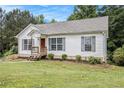 Inviting single-story home showcases a well-kept lawn, neutral siding, and a welcoming front porch at 1104 Driftwood Ct, Mcdonough, GA 30252