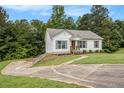 Lovely one-story home with neutral siding, a neat front yard, and a pathway leading to the front entrance at 1104 Driftwood Ct, Mcdonough, GA 30252