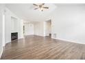 Bright living room boasts a fireplace, high ceilings, and modern flooring with ample natural light at 1104 Driftwood Ct, Mcdonough, GA 30252