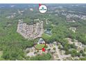 Aerial view of home in a wooded neighborhood near Lake Lanier at 3320 Goldmist Dr, Buford, GA 30519