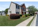 Attractive home with brick and vinyl exterior, green lawn, and well-manicured shrubbery at 3223 Tallon Sw Ln, Atlanta, GA 30311