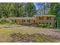 Charming brick home with a well-manicured front yard surrounded by mature trees at 3362 Northbrook Dr, Atlanta, GA 30340