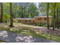 Charming brick home with a well-manicured front yard surrounded by mature trees at 3362 Northbrook Dr, Atlanta, GA 30340
