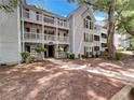 Inviting condo building with well-maintained landscaping and classic architecture at 219 Cobblestone Trl, Avondale Estates, GA 30002