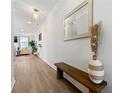 Inviting entryway featuring hardwood floors, a decorative mirror, and a stylish bench at 3610 Silvery Way, Powder Springs, GA 30127