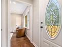 Welcoming entryway featuring a decorative oval glass front door and hardwood flooring at 522 Stell Rd, Woodstock, GA 30188