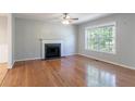 Bright living room featuring a fireplace and hardwood floors at 142 Wellspring Pt, Hiram, GA 30141