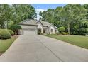 Beautiful home with a long driveway, two-car garage, and well-maintained landscaping at 1285 Rivershyre Pkwy, Lawrenceville, GA 30043