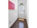 Welcoming entryway showcasing wood floors and a bright white door at 2034 Rockledge Ne Rd, Atlanta, GA 30324
