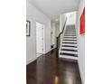 Hallway featuring a staircase, beautiful flooring, and artistic wall decor at 2034 Rockledge Ne Rd, Atlanta, GA 30324