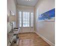 Bright entryway with hardwood floors and beach-themed artwork for a welcoming ambiance at 5492 Glenridge Dr # 536, Atlanta, GA 30342