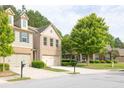 View of the home's exterior showcasing its well-manicured lawn and tree lined street at 3982 Brockenhurst Dr, Buford, GA 30519