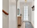 Inviting foyer with hardwood floors, natural light, and an elegant chandelier at 3982 Brockenhurst Dr, Buford, GA 30519