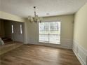 Dining area with natural light, neutral tones, and classic wainscoting detail at 2130 Chattahoochee Dr, Duluth, GA 30097