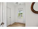 Bright entryway with a door, light hardwood floors, and white walls at 302 Bunker Hill Ct, Acworth, GA 30102