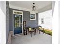Inviting front porch area featuring seating, decor and a 'Welcome' sign at 302 Bunker Hill Ct, Acworth, GA 30102