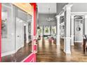 Spacious foyer featuring hardwood floors, soaring ceilings, and decorative columns at 4251 Lantern Hill Dr, Dacula, GA 30019