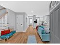 Inviting living room featuring an open floor plan, gleaming hardwood floors, and a cozy seating area at 786 Neal Nw St, Atlanta, GA 30318