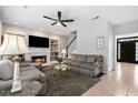 Inviting living room featuring a fireplace, built-ins, and lots of natural light at 9307 Glenleigh Way, Jonesboro, GA 30236