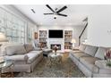 Cozy living room with built-in bookshelves and a marble fireplace at 9307 Glenleigh Way, Jonesboro, GA 30236