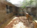 Brick home's wooden back deck needs clearing and maintenance at 2447 Omaha Sw Rd, Atlanta, GA 30331