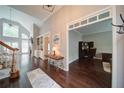 Inviting foyer with hardwood floors, high ceilings, and an open view to living spaces at 4645 Waterford Dr, Suwanee, GA 30024