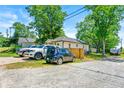 Property with ample parking space and a fenced backyard, perfect for outdoor activities at 1357 Railroad Ave, Sugar Hill, GA 30518