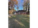 Cozy brick home with a well-kept front yard and mature trees at 4510 Burks Rd, Forest Park, GA 30297