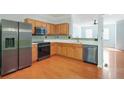 Modern kitchen features stainless steel appliances and beautiful countertops at 6887 Slate Stone Se Way # 3, Mableton, GA 30126