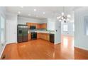 Well-lit kitchen offers stainless steel appliances and wood cabinetry at 6887 Slate Stone Se Way # 3, Mableton, GA 30126