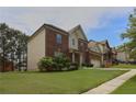 Brick home showing side of house with lovely green lawn in residential neighborhood at 1433 Sand Way, Lawrenceville, GA 30045