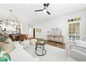 Cozy living room with a modern ceiling fan, neutral tones, and stylish decor at 273 12Th Ne St # 114, Atlanta, GA 30309