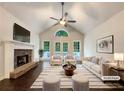 Bright living room with vaulted ceilings, a stone fireplace, and stylish furniture creates a cozy and inviting atmosphere at 339 Warrenton Dr, Douglasville, GA 30134