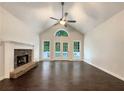 Bright living room featuring vaulted ceilings and a stone fireplace at 339 Warrenton Dr, Douglasville, GA 30134