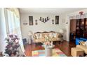 Living room with hardwood floors, antique furniture, and decorative wall hangings at 4256 Village Square Ln, Stone Mountain, GA 30083