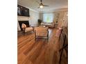 Cozy living room featuring hardwood floors, a fireplace, and natural light at 190 Grayland Creek Dr, Lawrenceville, GA 30046