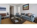 Inviting living room featuring hardwood floors, a comfortable couch, and stylish decor at 45 Ivan Allen Jr Blvd # 2203, Atlanta, GA 30308
