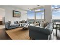 Comfortable seating area with large windows offers breathtaking city views and floods of natural light at 45 Ivan Allen Jr Blvd # 2203, Atlanta, GA 30308